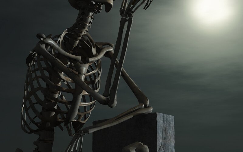 skeleton on a stone block