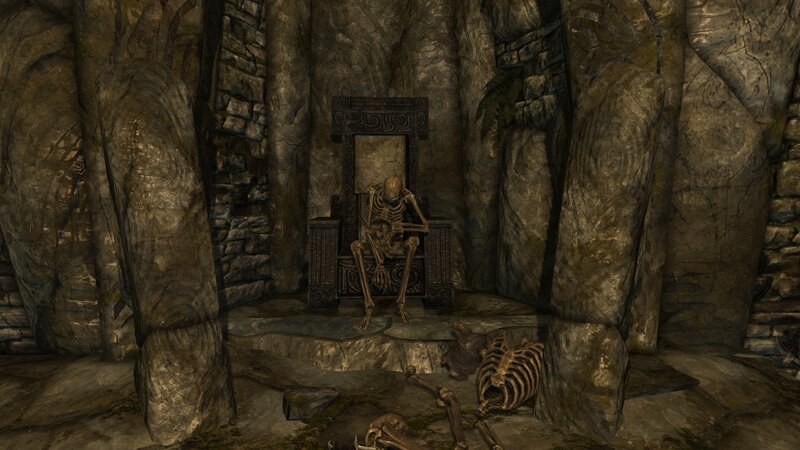 skeleton on a throne in cave