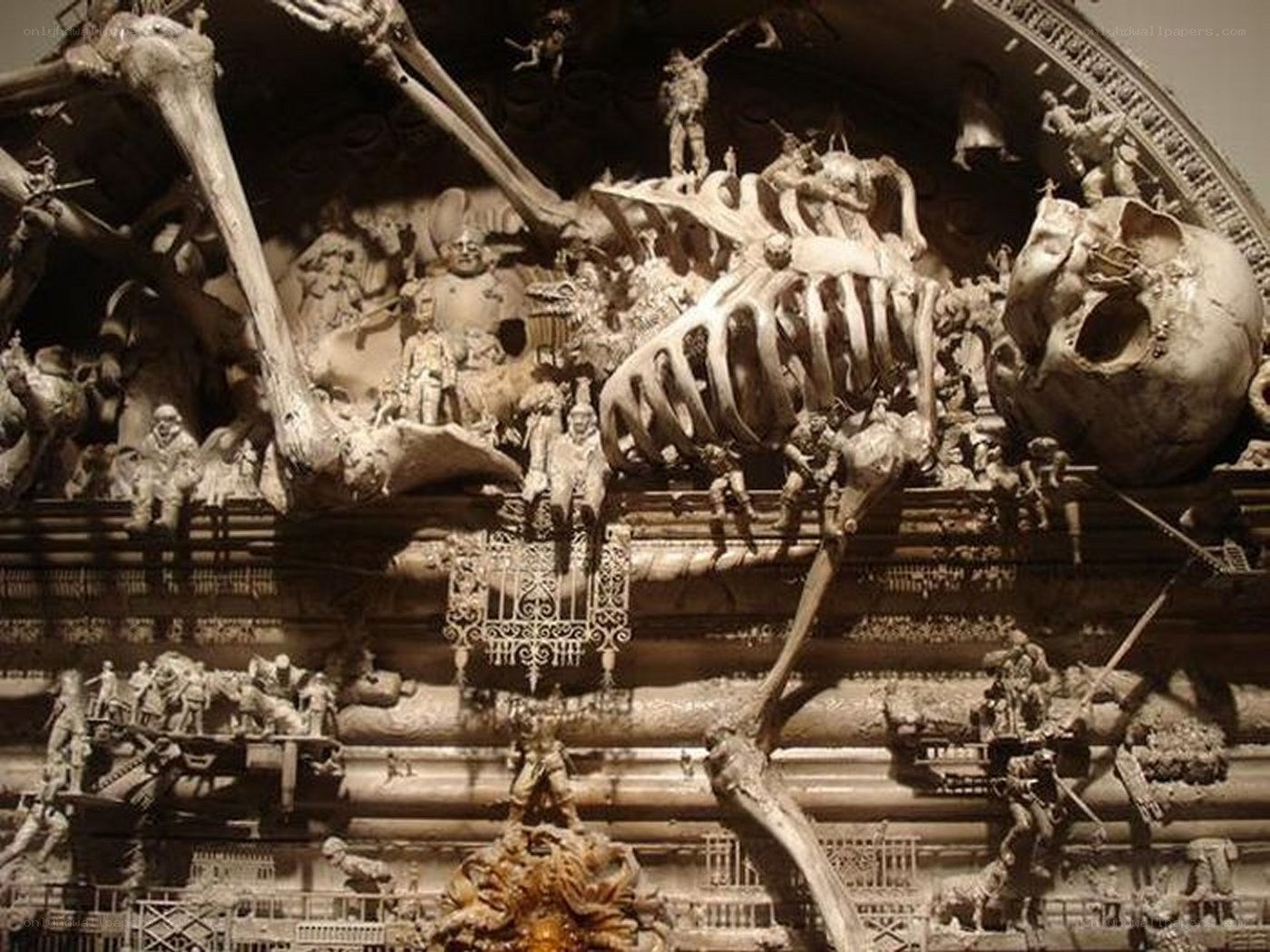 skeleton sculpture with figures