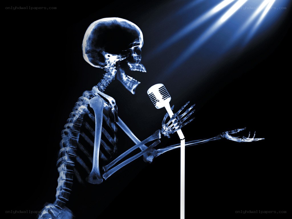 skeleton singing into microphone