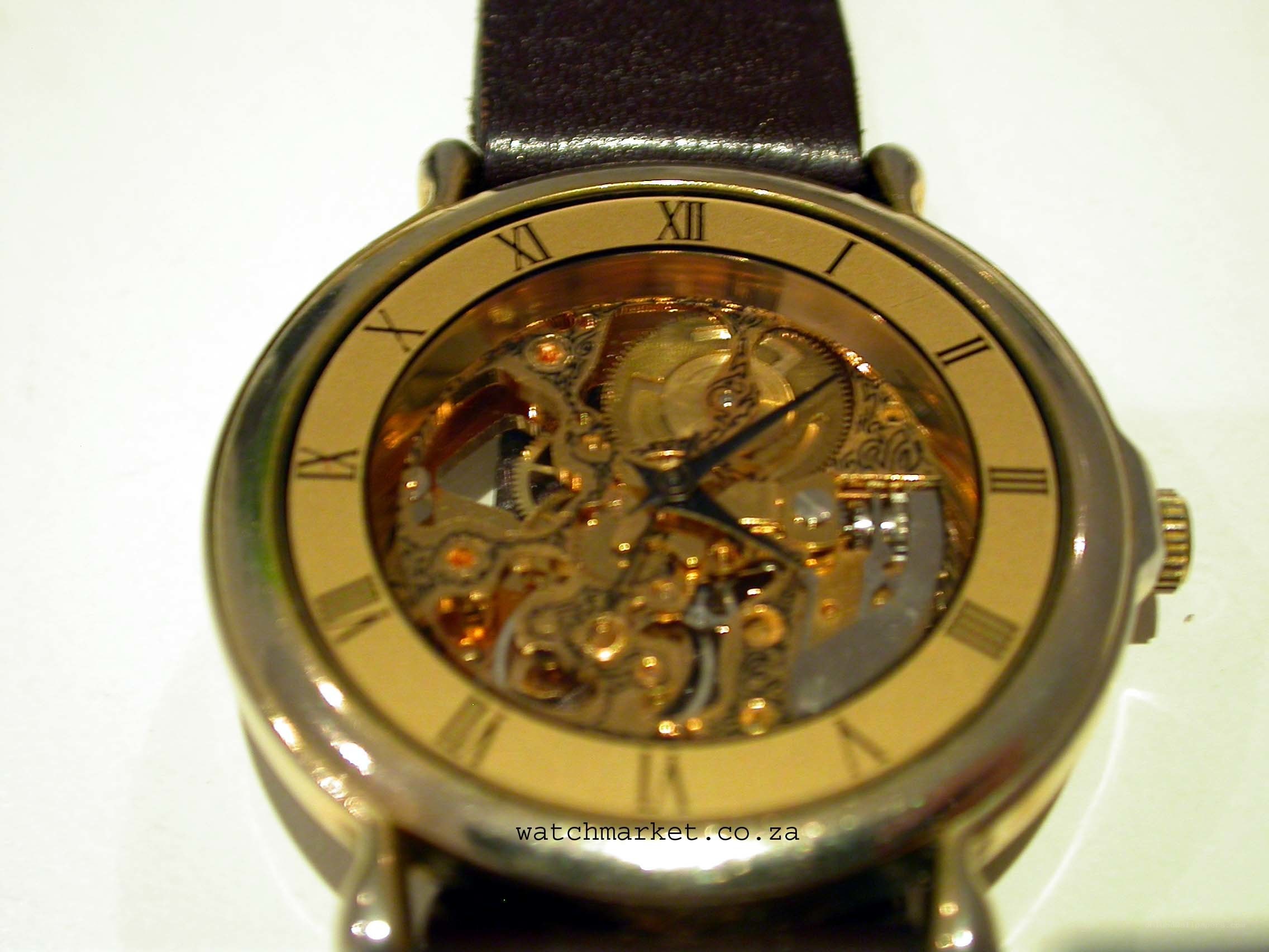 skeleton watch with leather strap