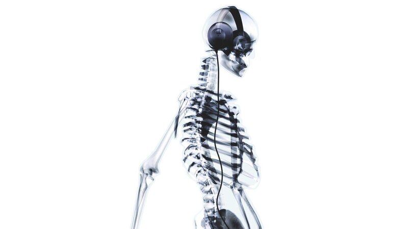 Skeleton Wearing Headphones — White