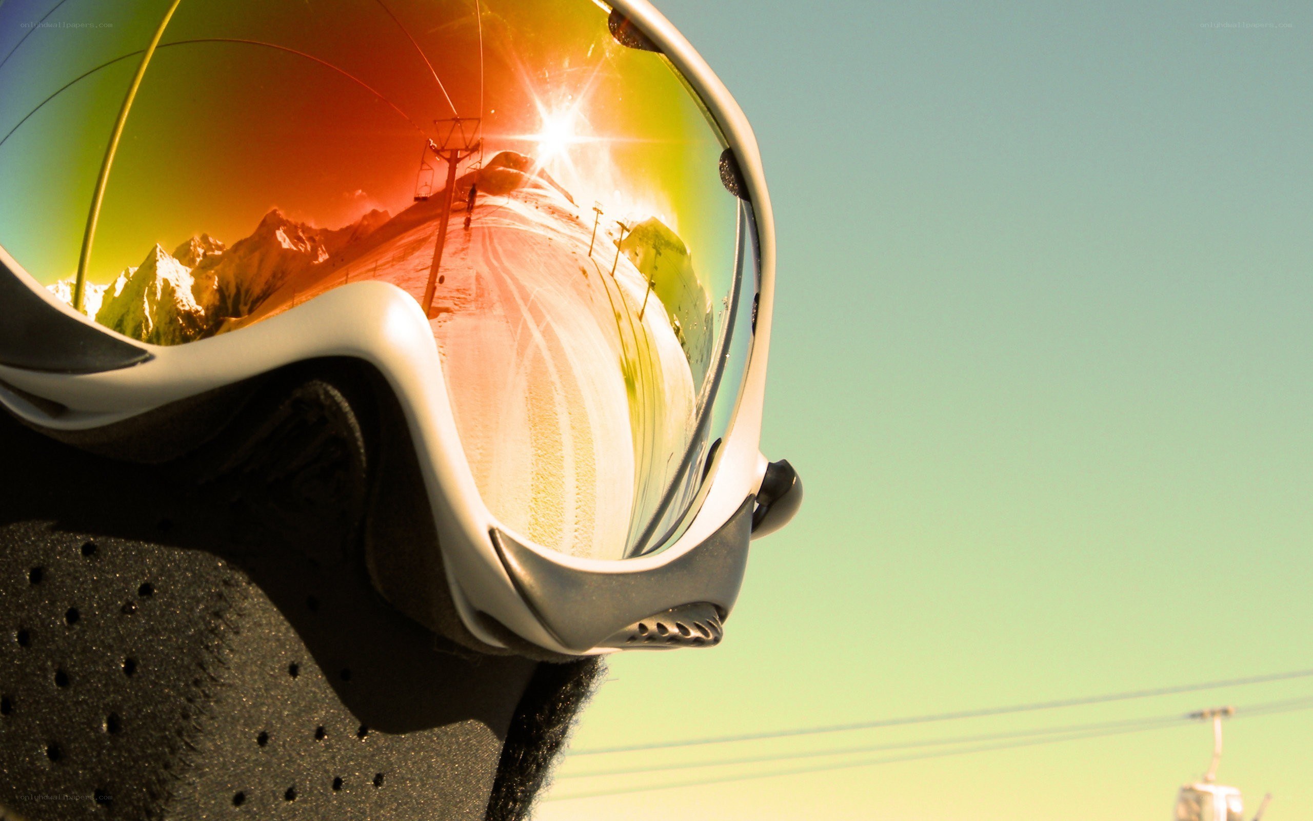 Ski goggles reflect mountain sun