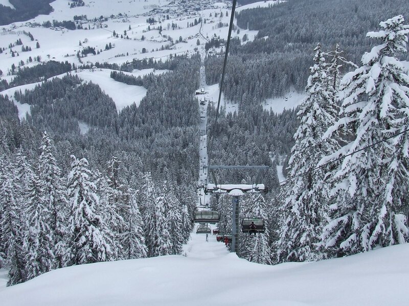 Ski Lift in Snowy Forest — White