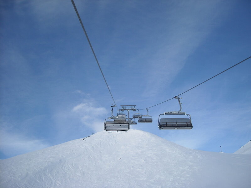 Ski lift on snowy mountain