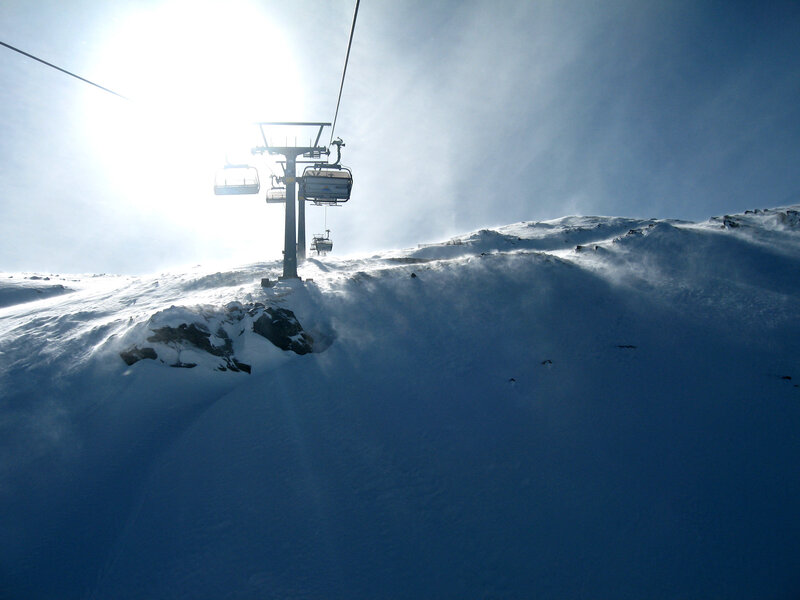 Ski lift on snowy mountain