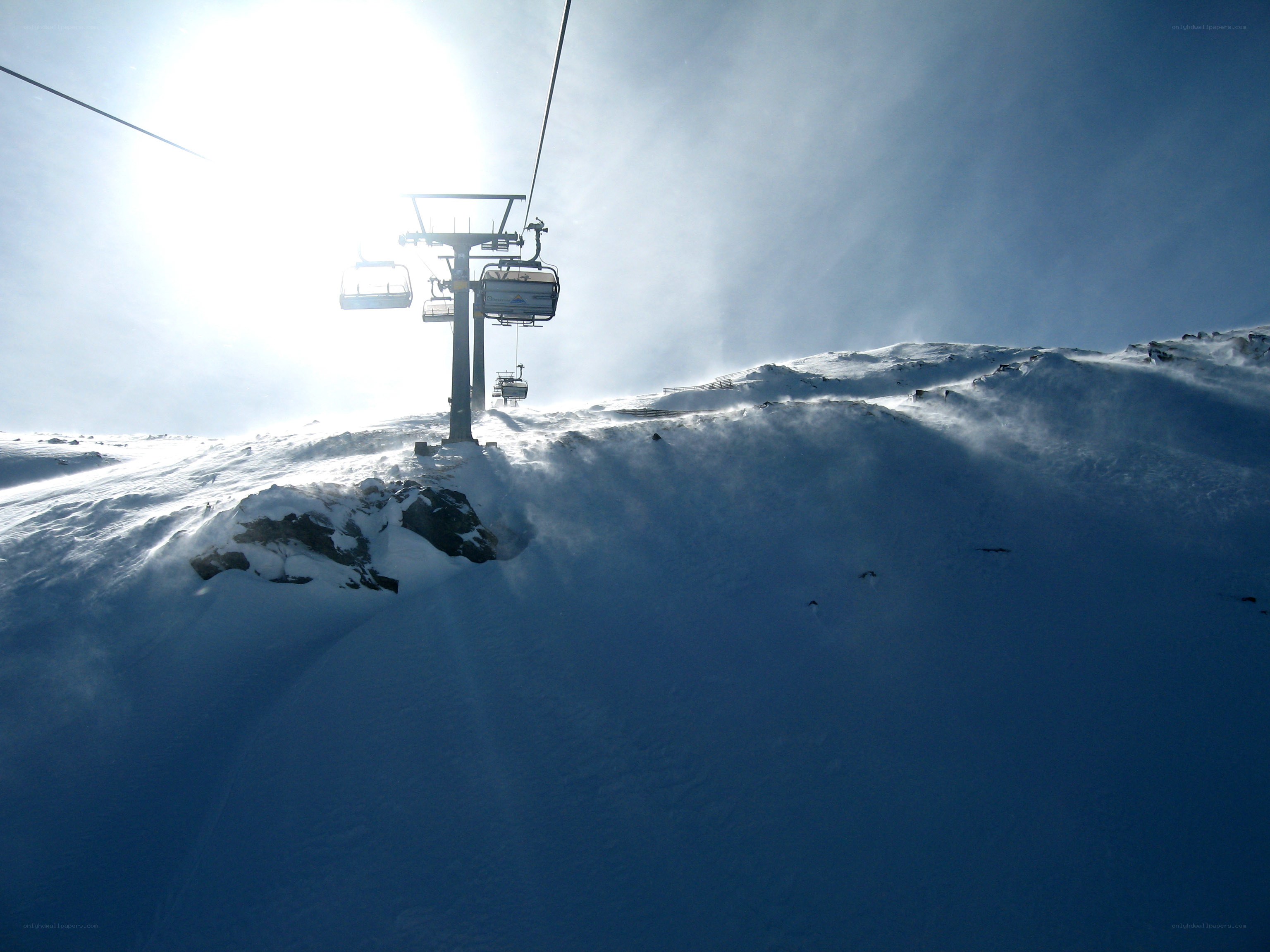 Ski lift on snowy mountain