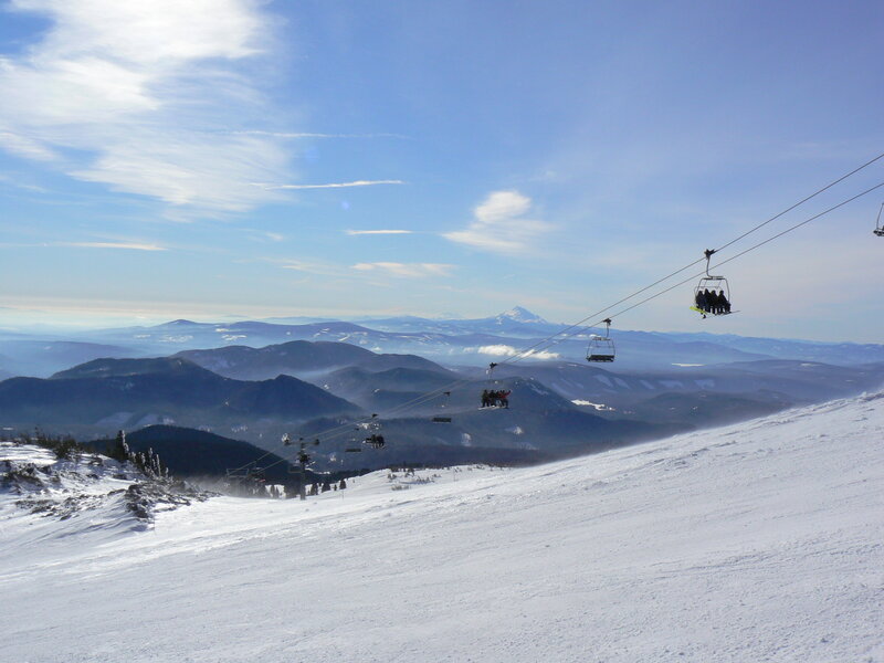 Ski lift over snowy mountains