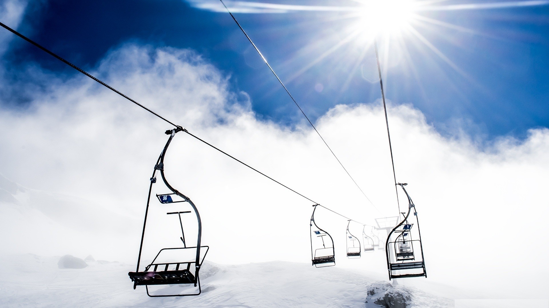 Ski lift under bright sun
