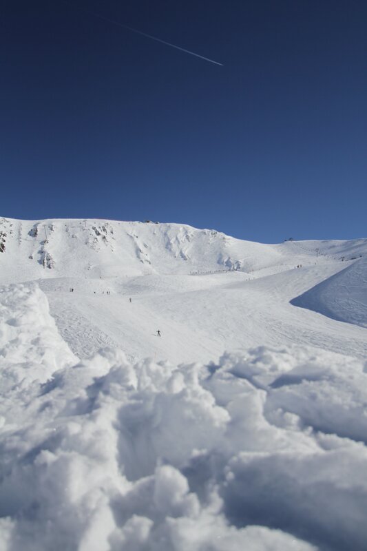 Ski slope under clear blue sky