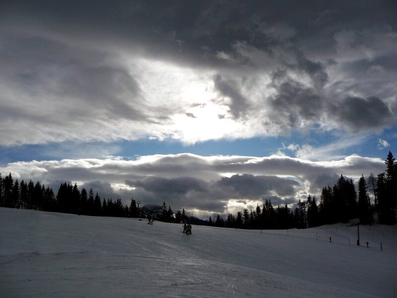 Ski slope under cloudy sky