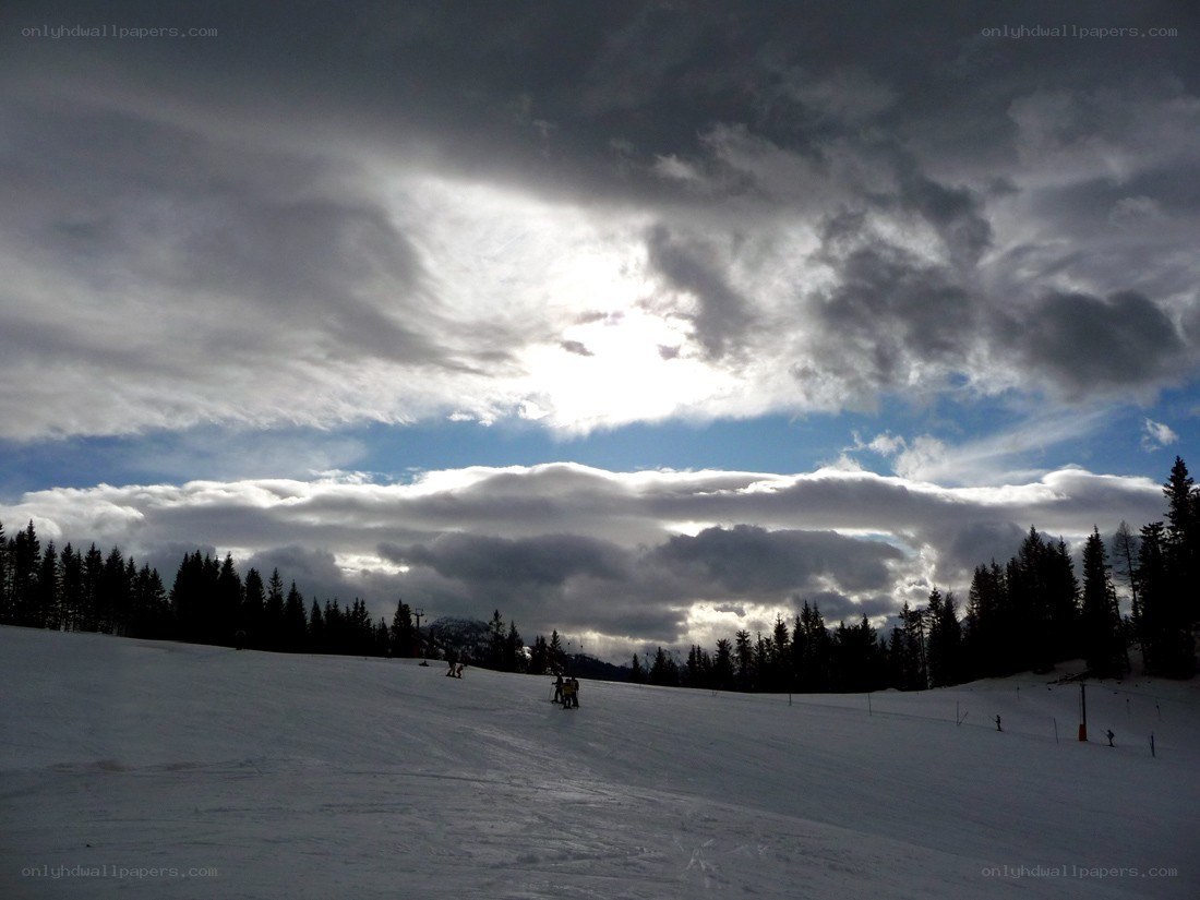 Ski slope under cloudy sky