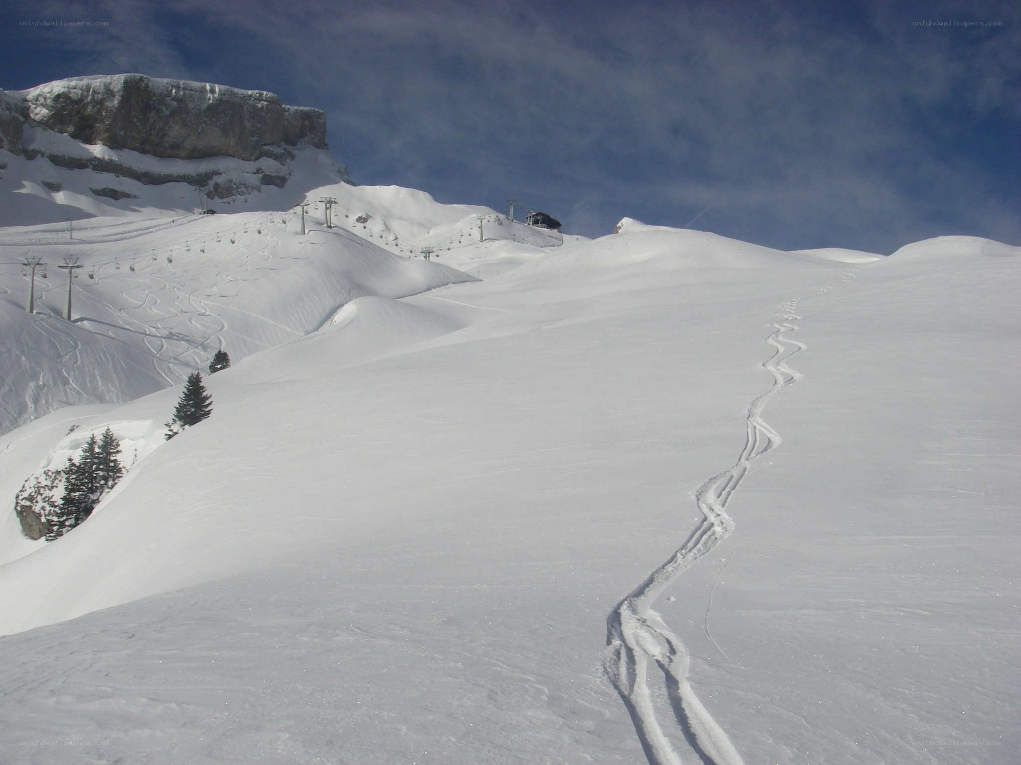 Ski tracks on a snowy mountain