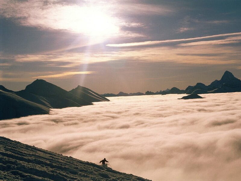 Skier above the clouds