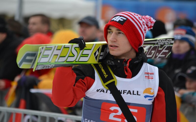 Skier Carrying Skis