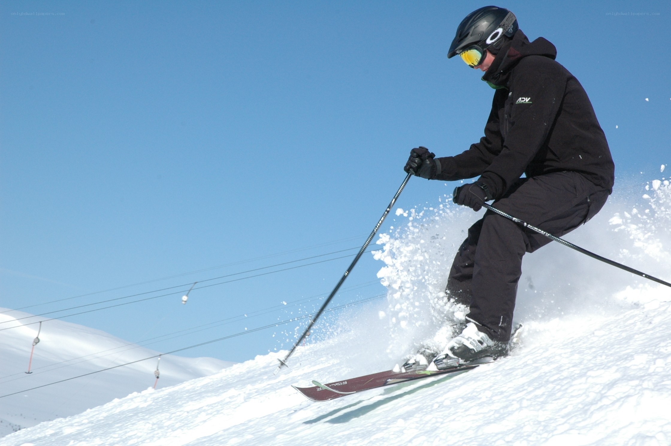Skier carving down a slope