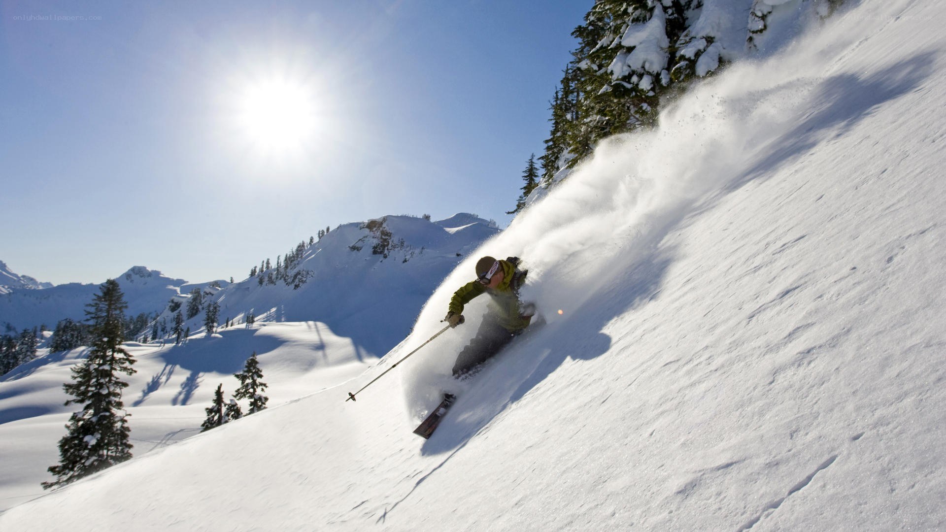 Skier carving down snowy slope