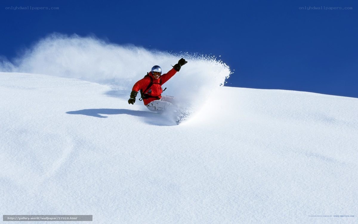 Skier carving through powder