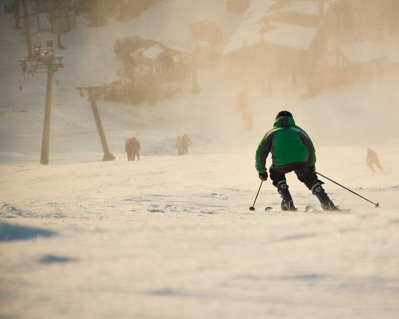 Skier in Green Jacket — White, Active, Winter