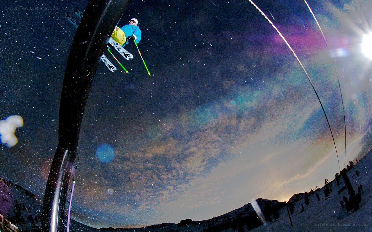 Skier in mid-air at night