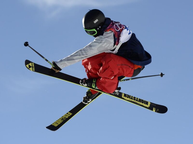 Skier in Mid-air Jump — Blue, Dynamic, Afternoon