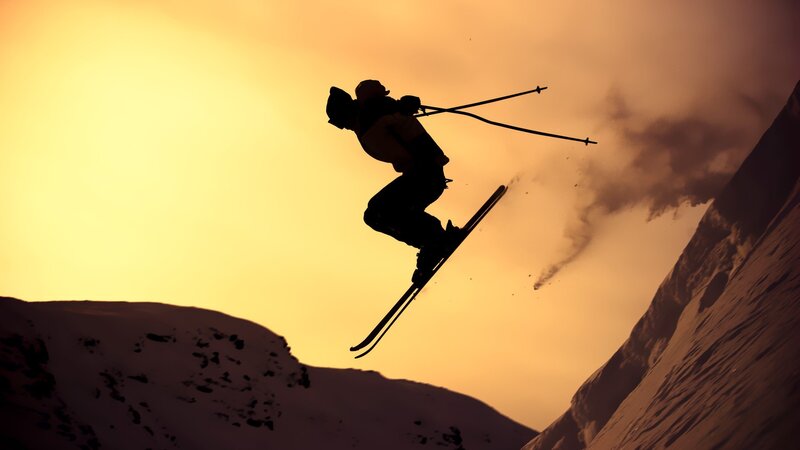 Skier in Mid-air Jump — Yellow, Dramatic, Sunset