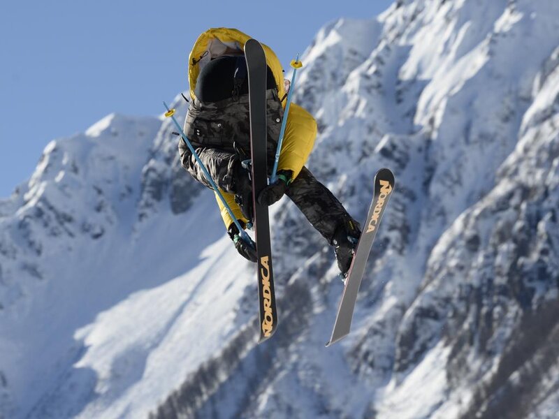 Skier in Mid-air Jump — Yellow, Dramatic