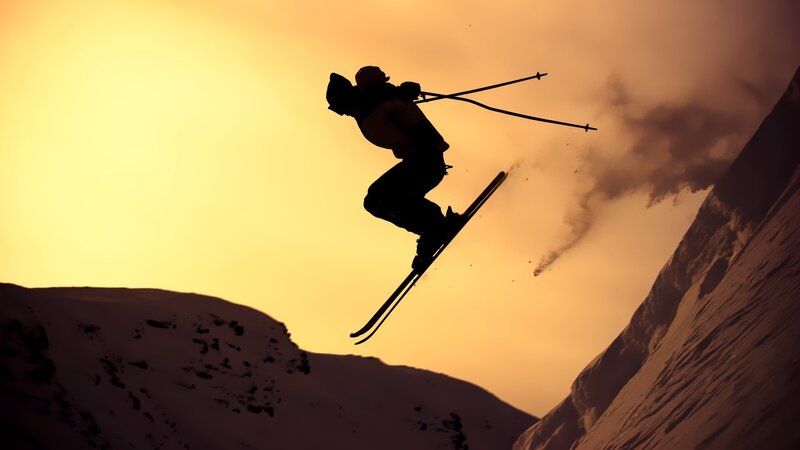 Skier in Mid-air Jump — Yellow
