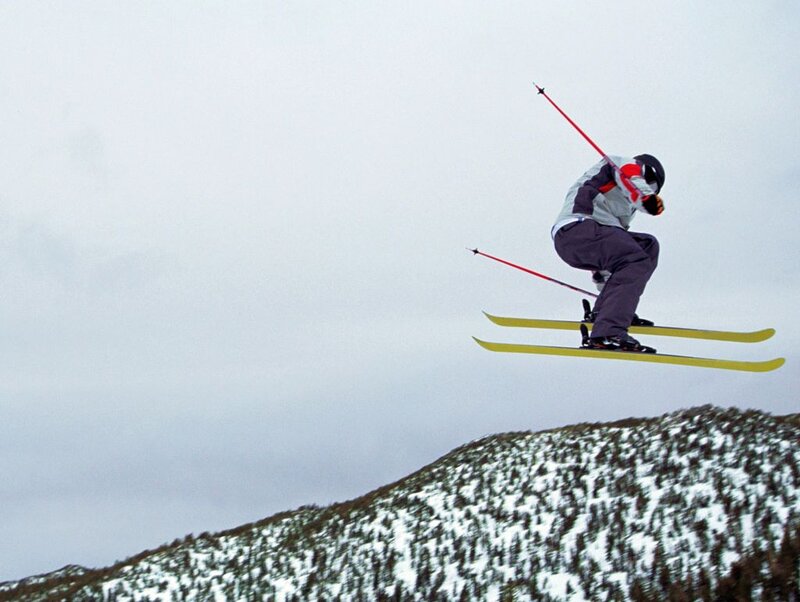 Skier in Mid-air — White