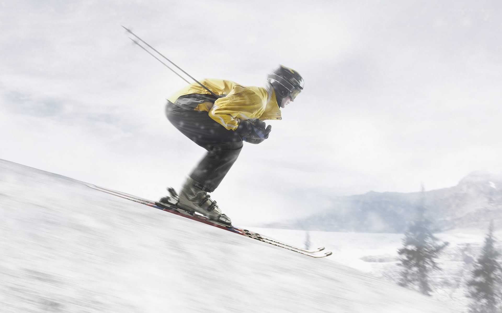 Skier in yellow jacket
