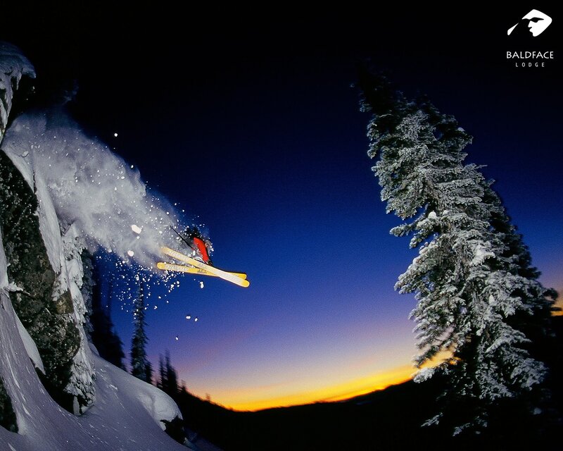 Skier jumping at dusk