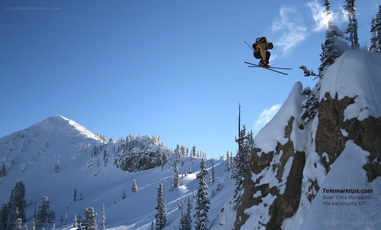 Skier jumping off a cliff