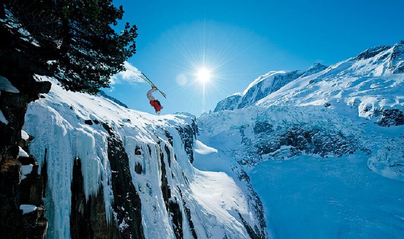 Skier Jumping Off Cliff — Blue
