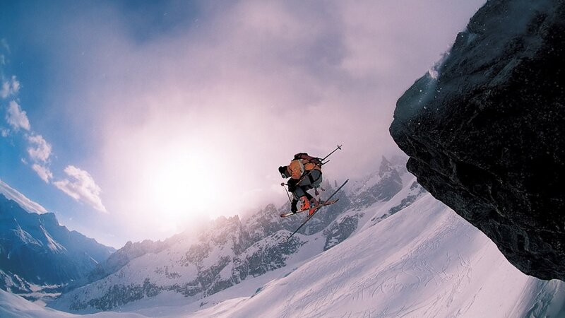 Skier Jumping Off Cliff — White