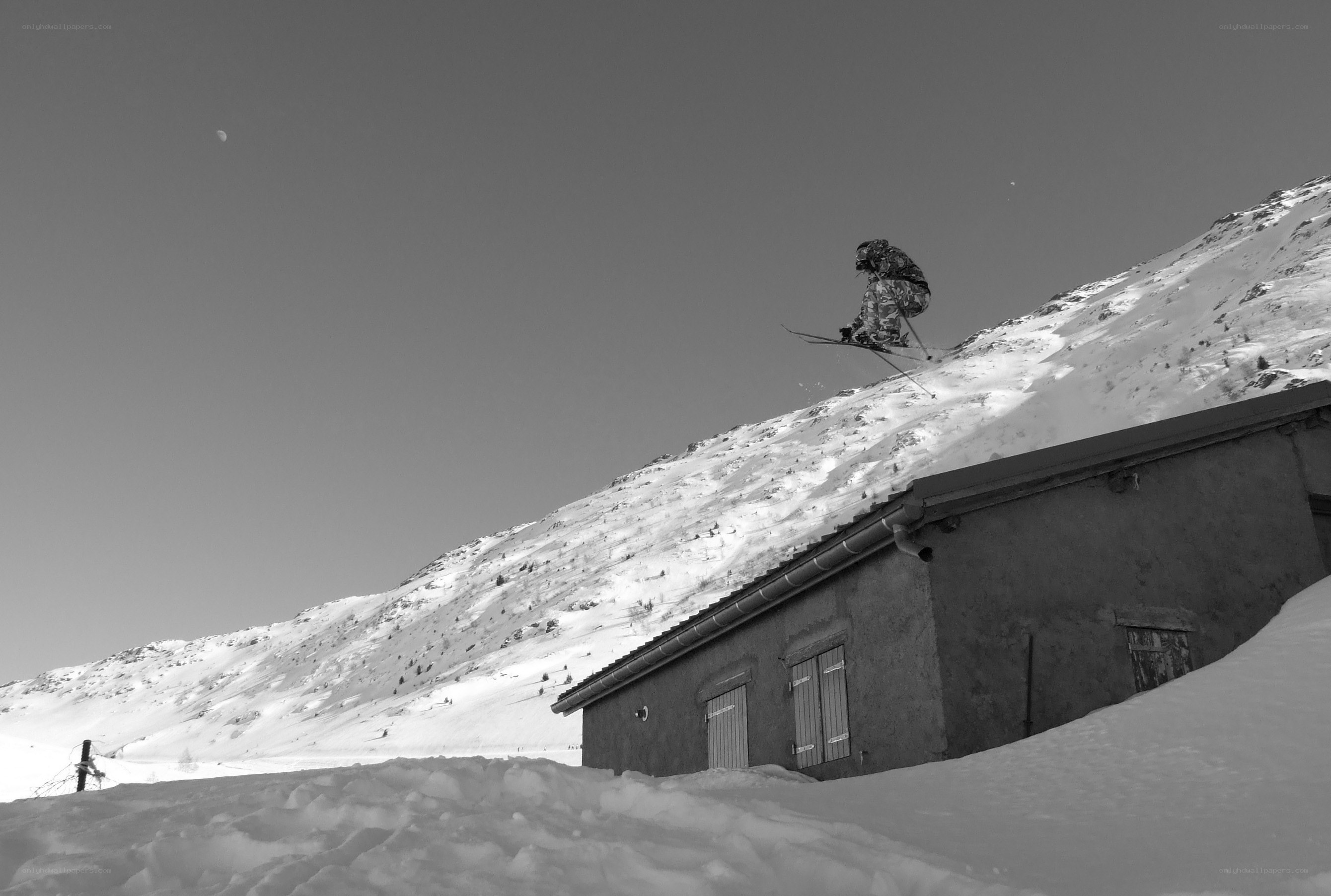 Skier jumping over a building
