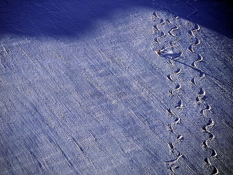 Skier leaving tracks on snowy slope