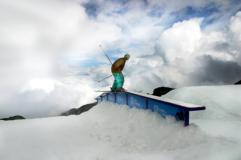 Skier on a rail at high altitude