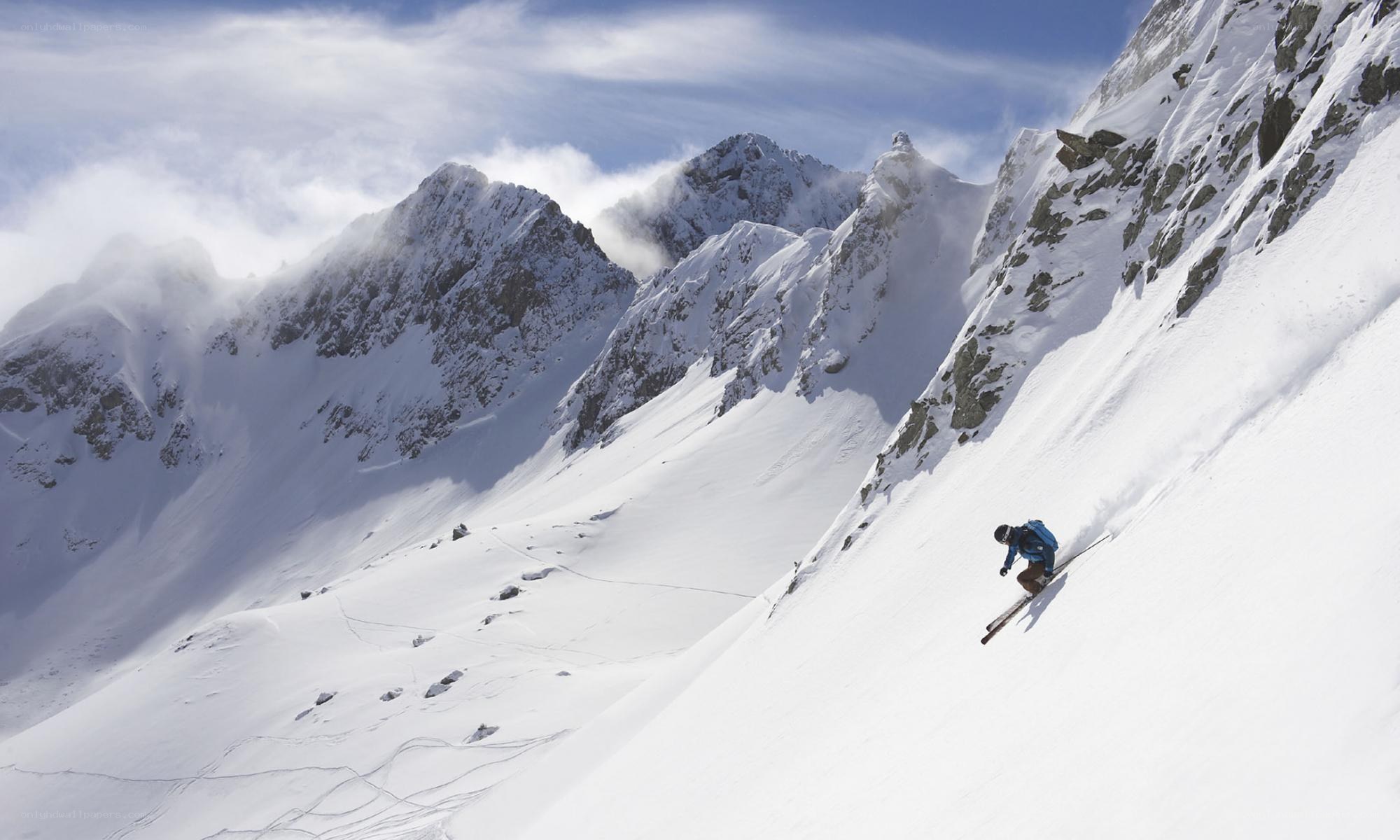 Skier on a snowy mountain slope