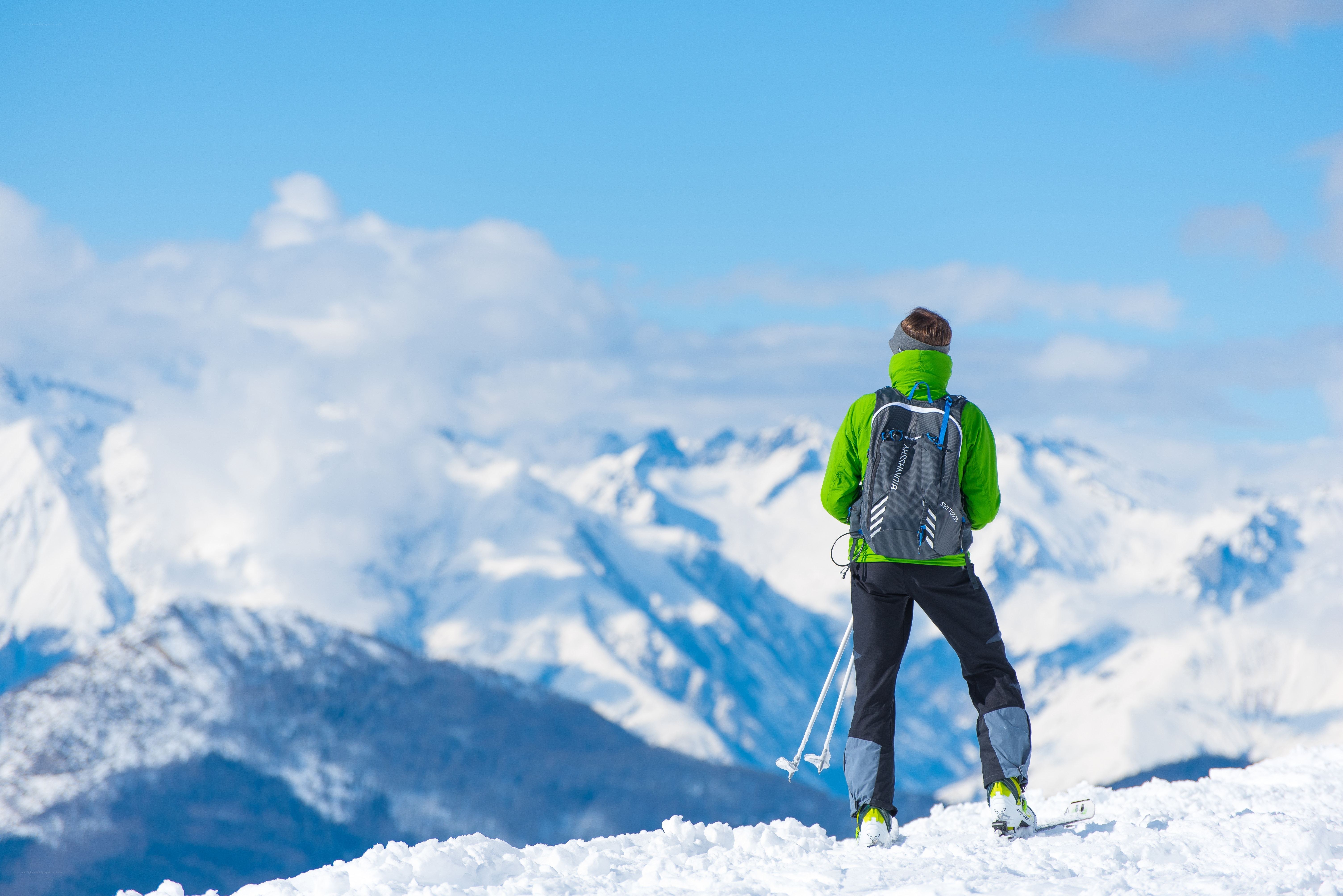 Skier on snowy mountain peak