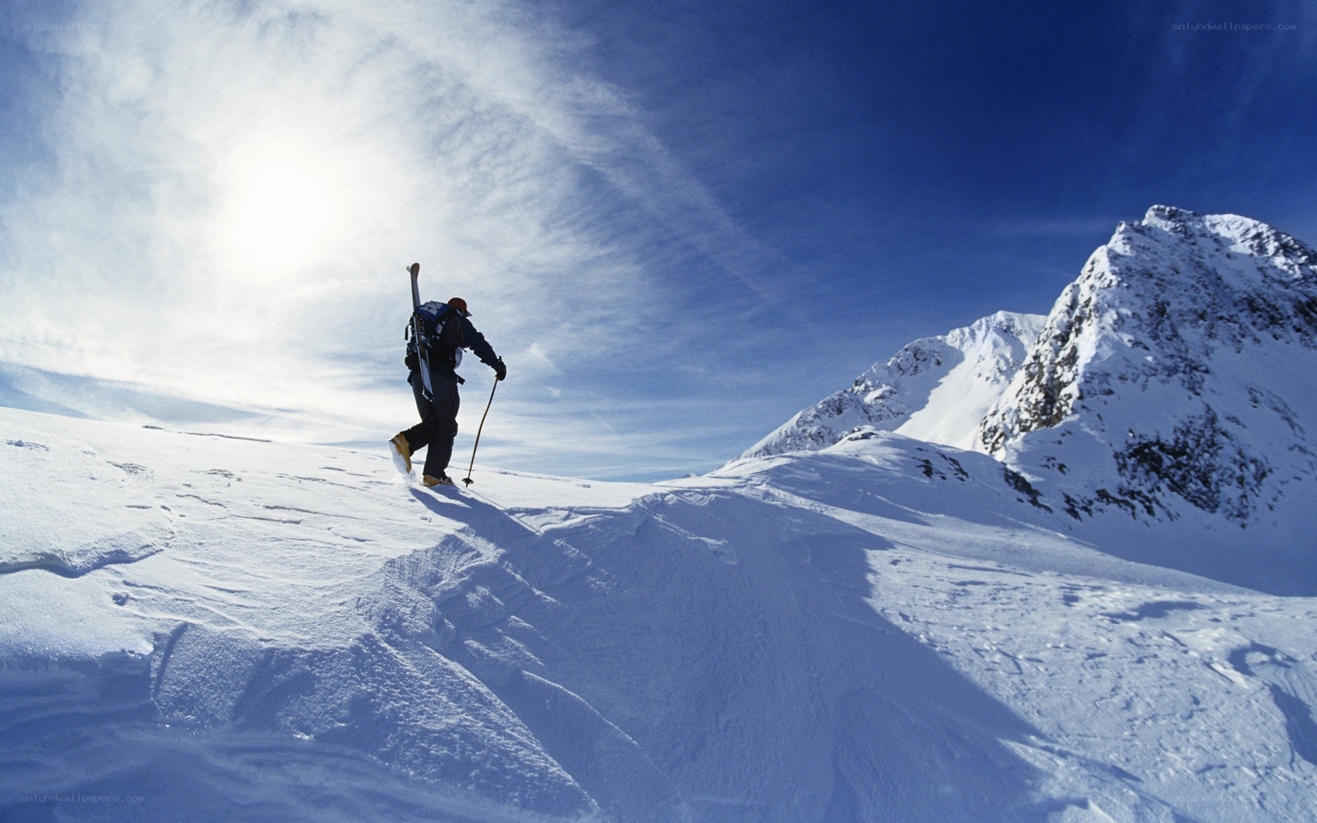 Skier on snowy mountain slope
