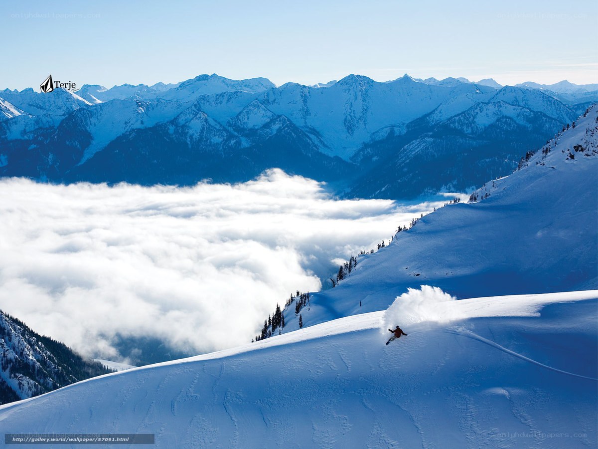 Skier on snowy mountain slope
