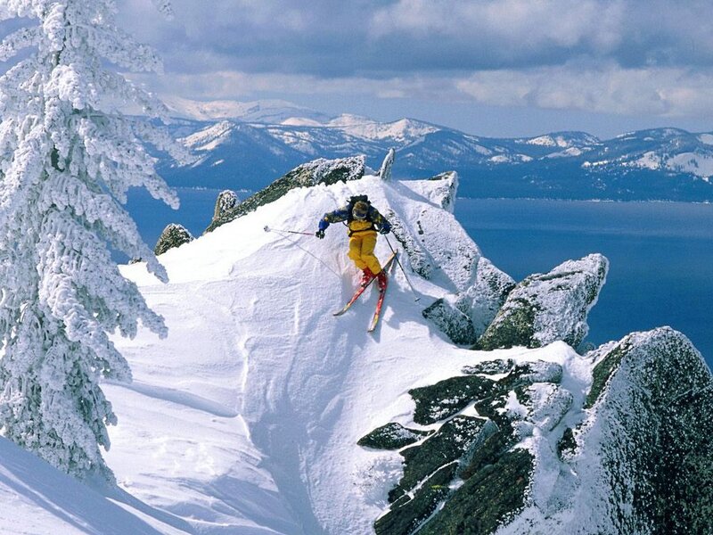 Skier on Snowy Ridge