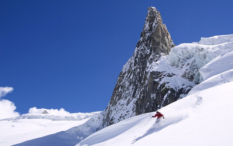 Skier on Snowy Slope — Blue, Dramatic, Afternoon