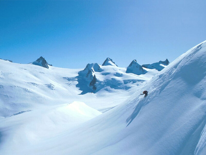 Skier on Snowy Slope — Blue, Serene