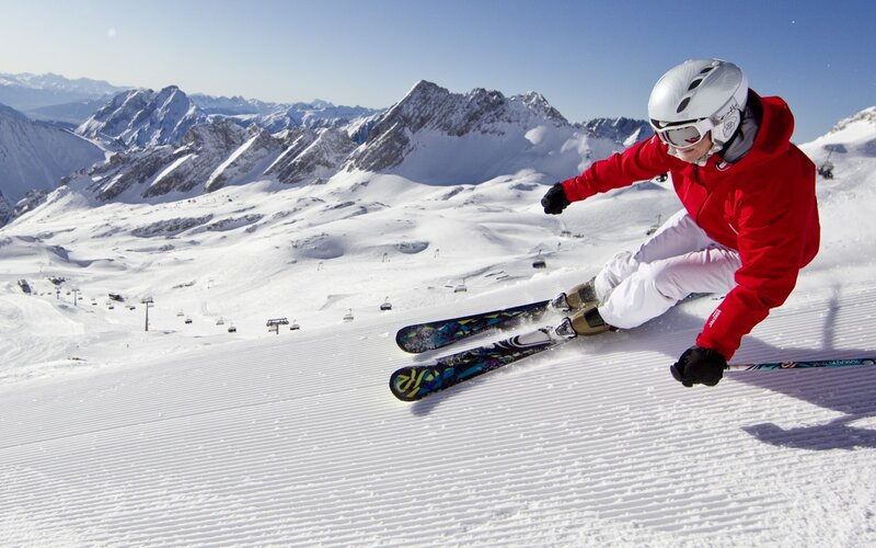 Skier on Snowy Slope — White, Active, Afternoon