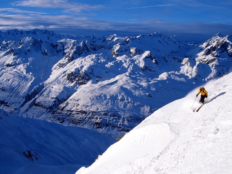 Skier on Snowy Slope — White, Dramatic, Winter, Photograph, Mountains, Sky, Snow, Blue
