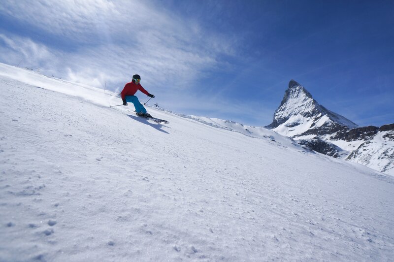 Skier on Snowy Slope — White, Dynamic