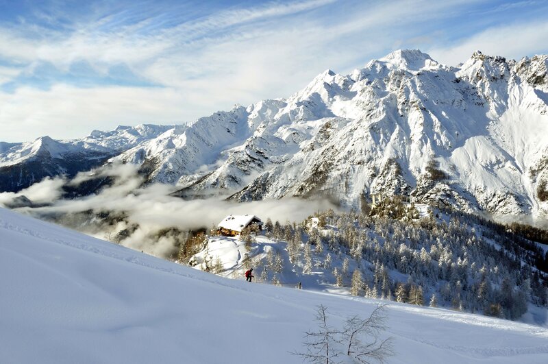Skier on Snowy Slope — White, Serene, Winter, Photograph, Mountains, Cabin