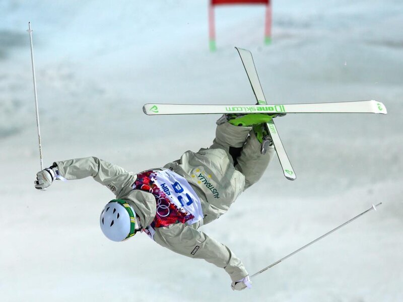 Skier Performing Aerial Trick — White