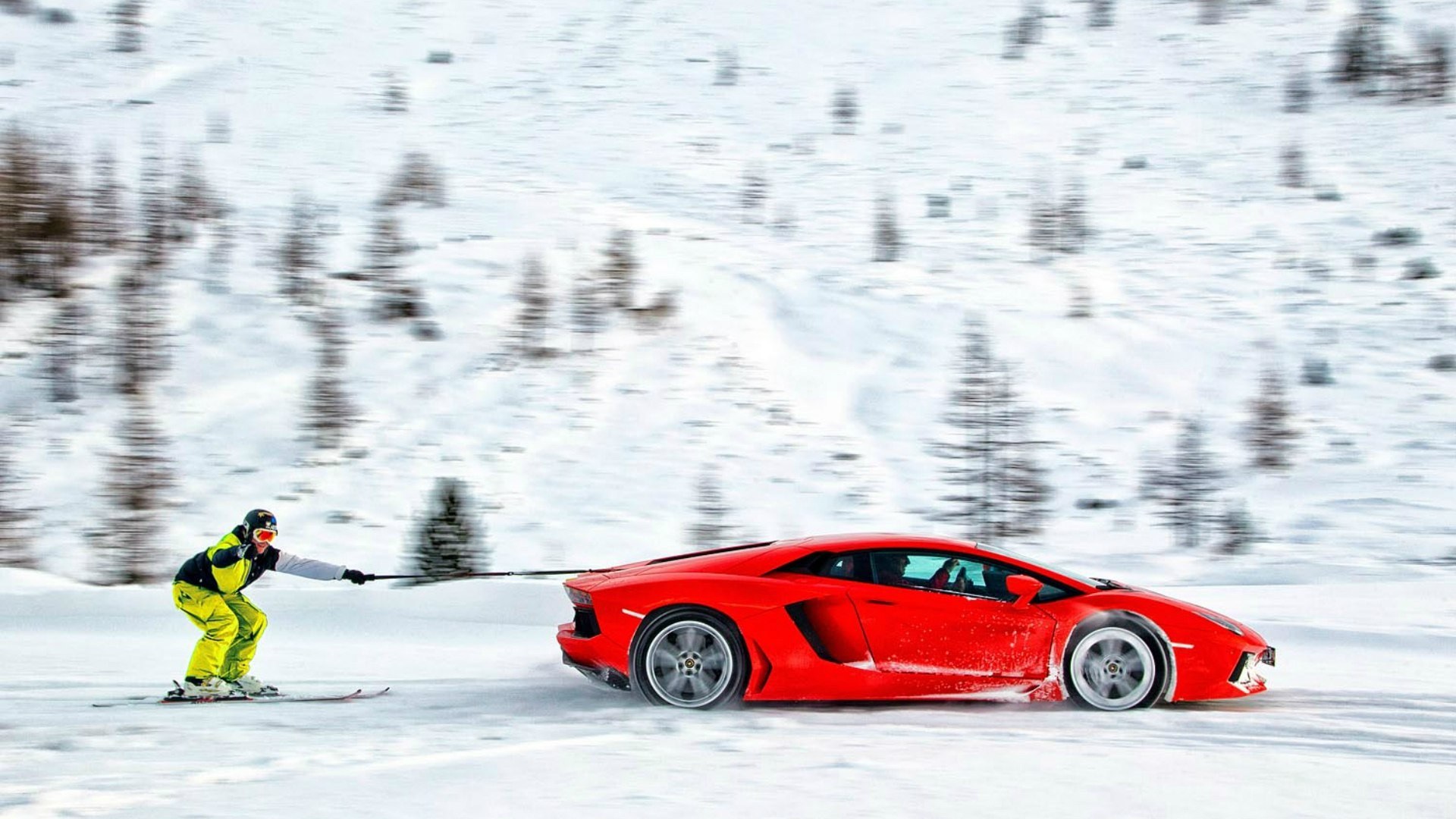 Skier pulling a sports car